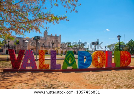 Colorful letters form the sign of Valladolid with a backdrop of Convent of San Bernardino de Siena. Valladolid, Yucatan, Mexico