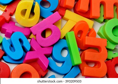Colorful letters on background closeup