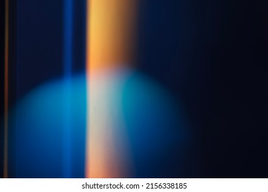 Colorful light leak on black background, abstract design with optical lens flare shot on a long lens.