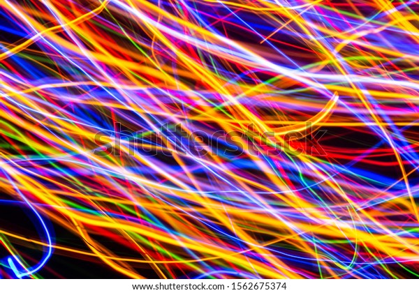 Colorful\
lights on the long exposure with motion background, Abstract\
glowing colorful lines, slow speed\
shutter\
