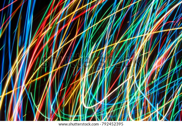 Colorful\
lights on the long exposure with motion background, Abstract\
glowing colorful lines, slow speed\
shutter