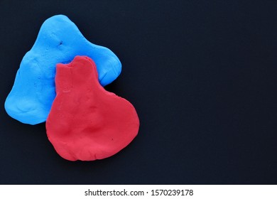 Colorful lightweight clay plasticine for children's creativity and a tool for making handmade slime on black background. Selective focus, childhood, creativity concept.  - Shutterstock ID 1570239178