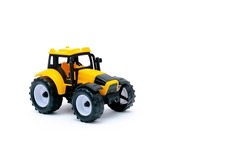 Colorful Little Mini Yellow Plastic Tractor, Truck, Lorry, Car Toy Isolated On White Background Mockup With Copy Space, Toys For Children, Kids Development, Playing, Childhood Fun.
