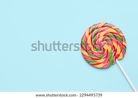 Colorful lollipop on blue background