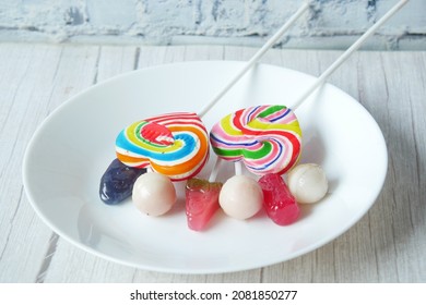 Colorful Lollipop Wrapper On A Plate On Table 