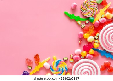 Colorful lollipops and different gummies jelly and candies, top view. - Powered by Shutterstock