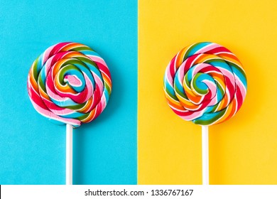 Colorful lollipops on blue and yellow background.  - Powered by Shutterstock