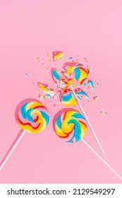 Colorful Lollipops On Pastel Pink Background, Top View. Minimal Sugar Detox, No Sugar And Junk Food Concept.