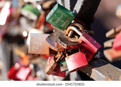 Colorful Love Locks on Metal Rail Symbolizing Lasting Love - Powered by Shutterstock