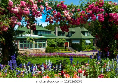 Colorful And Luscious Summer Gardens, Variety Of Flowers And Well Manicured Lawn, Shrubs And Trees With Water Fountains. A Peaceful Sanctuary For Visitors.