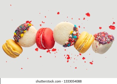 Colorful Macarons Cookies. French Cakes. Sweet And Colorful French Macaroons Fall Or Fly In Motion. With Slices