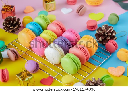 Colorful macarons dessert with vintage pastel tones. Colorful French macarons background, Different colorful macaroon background. Tasty sweet color macaron