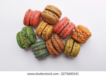 colorful macarons dessert with vintage pastel tones on white background 