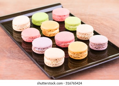 Colorful Macarons On A Lacquer Tray Close Up