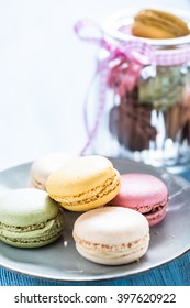 Colorful Macaroon Cookies On Plate, Vintage Cookie Jar In Background