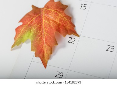 Colorful Maple Leaf On The Calendar Indicating The First Day Of Fall Or Autumn With A Shallow Depth Of Field