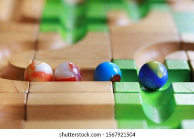 Colorful Marble Run On Wooden Track, Wooden Toy, Selective Focus