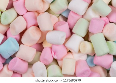 Colorful marshmallows as background, macro. Fluffy marshmallows texture close up.