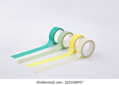 colorful masking tape rolls background on white