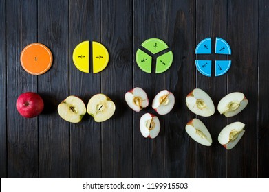 colorful math fractions and apples as a sample on brown wooden background or table. interesting math for kids. Education, back to school concept. Geometry and mathematics materials. - Shutterstock ID 1199915503