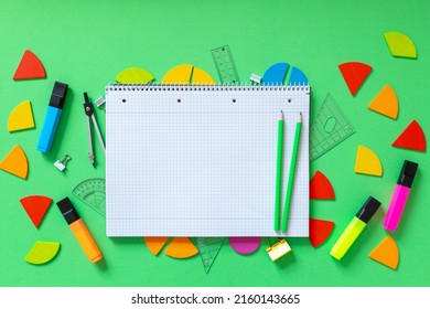 Colorful Math Fractions, Rulers, Open Notepad On A Green  Background. Interesting, Fun Math For Kids. Education, Back To School Concept