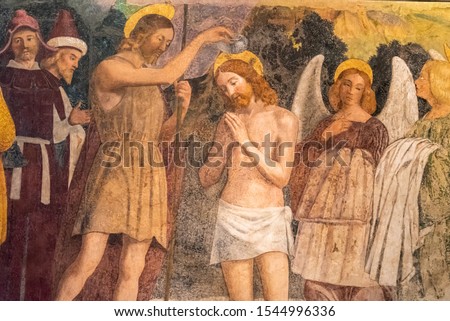 Colorful medieval fresco showing Jesus´ baptism