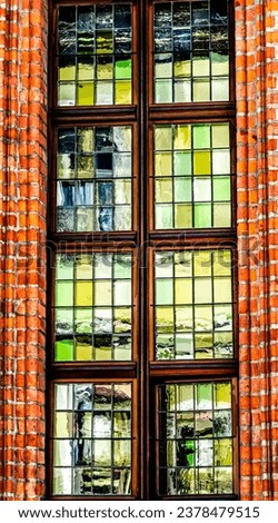 Colorful Medieval Windows Abstract Copernicus House Torun Poland.  Birthplace in 1453 of Nicolaus Copernicus, Scientist who discovered Sun Center of Solar System. 