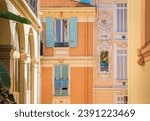 Colorful Mediterranean house facades of luxury apartment buildings with ornate designs in Monte Carlo, Monaco, Cote d