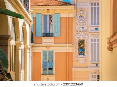 Colorful Mediterranean house facades of luxury apartment buildings with ornate designs in Monte Carlo, Monaco, Cote d'Azur on the French Riviera