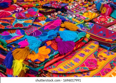 Colorful Mexican blankets for sale at market, Latin America. Mexico travel background.
