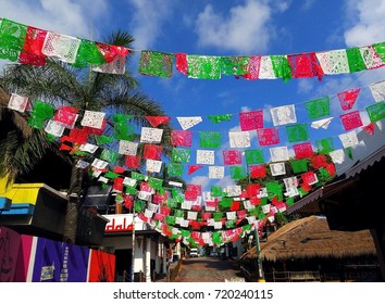 Colorful Mexican Flags Decorating Street Near Quinta Avenida (5th Avenue) In Center Of Playa Del Carmen, Riviera Maya, Mexico For Mexican Independence Day / Cry Of Dolores  