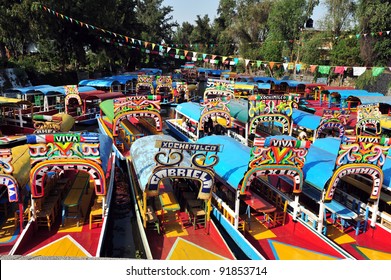 Colorful Mexican Gondolas At Xochimilco's Floating Gardens In Mexico City, Mexico. No People. Copy Space