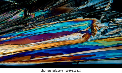 Colorful Microscopic View Of Epsom Salt Or Magnesium Sulfate Heptahydrate Crystals. Abstract Background Texture.  Captured Under Polarized Light With A Microscope.