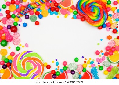 Colorful mixed candies. Top view frame over a white background. - Powered by Shutterstock