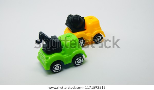 colorful mobile crane truck and concrete mixer\
model isolated on grey\
background