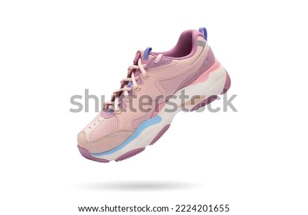 Colorful modern womens sport sneaker isolated on white background. Fashionable stylish shoe. Creative minimalistic footwear layout. Lifestyle product photo, levitation and urban style concept.