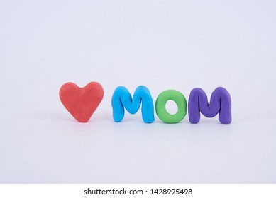 Colorful Mom Letters And Heart Shaped Play Doh On White Background