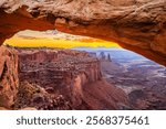 A colorful morning sunrise at the Mesa Arch in the Island in the Sky district of the Canyonlands National Park near Moab in Utah United States.