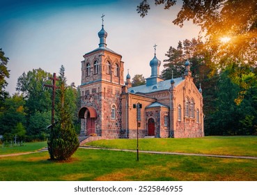 Colorful morning view of stone Orthodox Church of St. Anne. Amazing summer cityscape of Krolowy Most village. Great sunrise in Poland, Europe. Traveling concept background. - Powered by Shutterstock