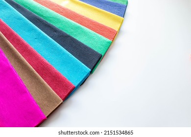 colorful multi-colored crepe paper in rolls. Corrugated paper, colored crepe. Designed for decorating creative works, decorating DIY crafts, packing flowers.