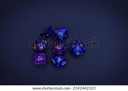 colorful multisided dice set on dark background 
