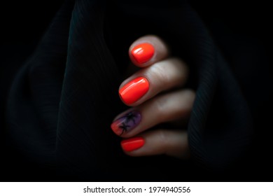 Colorful nail design black background  Bright orange nail polish and ombre details   hand painted palm trees  Selective focus finger  blurred background 