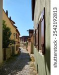  Colorful Narrow Alley Rothenburg ob der Tauber Germany. A narrow alley in the medieval heritage city of Rothenburg ob der Tauber, Germany.

                              