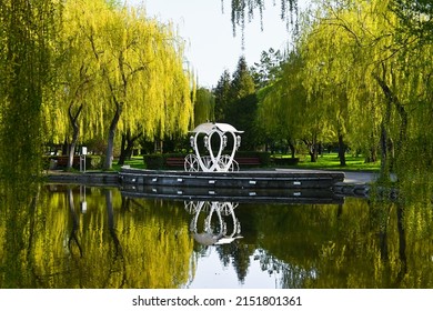 colorful national park. large lake in the park. willow tree branches hang over the water. clear mirror lake. reflection of trees in the lake.