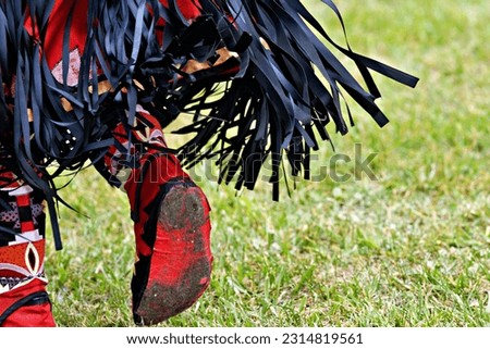 Colorful Native American man’s traditional dress moccasins at a pow-wow in Virginia.