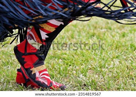 Colorful Native American man’s traditional dress moccasins at a pow-wow in Virginia.