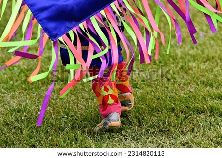 Colorful Native American woman’s traditional dress moccasins at a pow-wow in Virginia.
