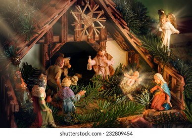 Colorful Nativity Scene with baby Jesus, Mary, Joseph, an angel and other famous religious figures of the bible, enhanced with rays of light for devotional mood