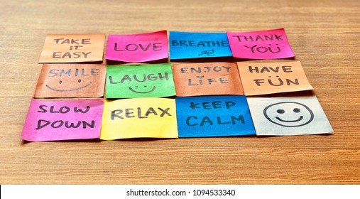 Colorful notes and hand writing positive attitude words the wooden background