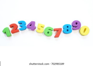 Colorful numbers on a white background. Children's figures from vinyl from 0 to 9. 
